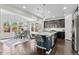 Spacious kitchen with island, dining area, stainless appliances, and dark wood cabinetry at 20529 E Brunswick Pl, Aurora, CO 80013