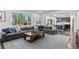 Spacious living room with a large window, comfortable seating, and an open layout at 20529 E Brunswick Pl, Aurora, CO 80013