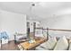 Upstairs living room featuring hardwood floors and ample natural light, ideal for relaxing and entertaining at 20529 E Brunswick Pl, Aurora, CO 80013