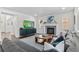 Cozy living room with a fireplace, large sectional sofa, and stylish decor at 20529 E Brunswick Pl, Aurora, CO 80013