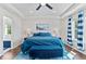 Bright main bedroom with tray ceiling and decorative blue accents and a water-themed carpet at 20529 E Brunswick Pl, Aurora, CO 80013