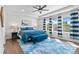 Relaxing main bedroom featuring tray ceilings, a ceiling fan, and ample natural light at 20529 E Brunswick Pl, Aurora, CO 80013