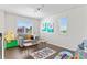 Inviting playroom with natural light, hardwood floors, comfortable seating, and toys at 20529 E Brunswick Pl, Aurora, CO 80013