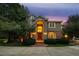 Inviting two-story home showcasing brick and stucco with well-manicured landscaping at 2230 E Grand Ave, Cherry Hills Village, CO 80113