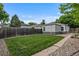 Backyard featuring grass, wooden fence and low-maintenance rock landscaping at 2640 S Marion St # 2646, Denver, CO 80210