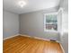 Bedroom with hardwood floors and a bright window with blinds at 2640 S Marion St # 2646, Denver, CO 80210