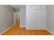 Bedroom features hardwood floors and a built-in wardrobe for storage at 2640 S Marion St # 2646, Denver, CO 80210