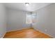 Cozy bedroom with hardwood floors and a window at 2640 S Marion St # 2646, Denver, CO 80210