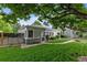 Charming front yard showcasing lush lawn, garden beds, and a welcoming pathway at 2640 S Marion St # 2646, Denver, CO 80210