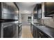 Modern kitchen boasting stainless steel appliances, sleek cabinets, and tile flooring at 2640 S Marion St # 2646, Denver, CO 80210