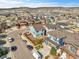 Aerial view of a residential neighborhood with houses featuring varied architectural styles and landscaping at 3266 Riverwood Way, Castle Rock, CO 80109