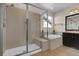 Elegant bathroom featuring a glass-enclosed shower and a soaking tub at 3266 Riverwood Way, Castle Rock, CO 80109