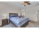 Well-lit bedroom with a ceiling fan, neutral walls, and a plush carpet at 3266 Riverwood Way, Castle Rock, CO 80109