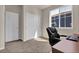 This bedroom features neutral walls, carpet floors, closet, and natural light from the window at 3266 Riverwood Way, Castle Rock, CO 80109