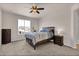 Comfortable bedroom with a ceiling fan and a large window at 3266 Riverwood Way, Castle Rock, CO 80109