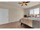 Bedroom with a window offering neighborhood views at 3266 Riverwood Way, Castle Rock, CO 80109