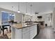 Open floorplan features a kitchen island flowing into the dining and living areas at 3266 Riverwood Way, Castle Rock, CO 80109