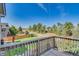 Expansive backyard view from the deck with a lush green lawn and mature trees at 9905 Aftonwood St, Highlands Ranch, CO 80126