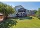 A well-maintained backyard with an upper deck and artificial grass at 9905 Aftonwood St, Highlands Ranch, CO 80126