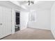 Bright basement with a window and a glimpse of a bathroom through an open door at 9905 Aftonwood St, Highlands Ranch, CO 80126
