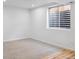 Basement area with window and carpeted floor at 9905 Aftonwood St, Highlands Ranch, CO 80126