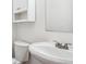 Simple bathroom with a white sink and toilet at 9905 Aftonwood St, Highlands Ranch, CO 80126