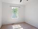 Bedroom featuring one window providing natural light and neutral carpeting at 9905 Aftonwood St, Highlands Ranch, CO 80126