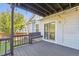 Outdoor deck with bench, string lights, and sliding door to the home at 9905 Aftonwood St, Highlands Ranch, CO 80126