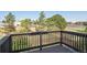 View from a dark-stained deck surrounded by trees and greenery at 9905 Aftonwood St, Highlands Ranch, CO 80126