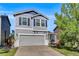 Charming two-story home with a two-car garage and manicured lawn at 9905 Aftonwood St, Highlands Ranch, CO 80126