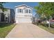 Charming two-story home with a well-maintained front yard and attached two-car garage at 9905 Aftonwood St, Highlands Ranch, CO 80126