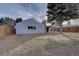 Large backyard with a combination of lawn and mulch, along with a cozy covered patio at 731 Uvalda St, Aurora, CO 80011