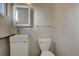 Bathroom featuring a toilet and a vanity with a sink at 731 Uvalda St, Aurora, CO 80011