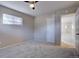 An open bedroom with new carpet, light walls, and a ceiling fan at 731 Uvalda St, Aurora, CO 80011
