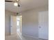 Bedroom with a ceiling fan and doorways leading to other rooms at 731 Uvalda St, Aurora, CO 80011