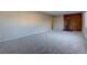 Spacious living room with a fireplace, carpet, and lots of natural light at 731 Uvalda St, Aurora, CO 80011