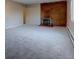 Spacious living room with a fireplace, carpet, and lots of natural light at 731 Uvalda St, Aurora, CO 80011