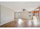 Spacious living area featuring hardwood floors, a ceiling fan, and neutral walls at 16351 E 104Th Pl, Commerce City, CO 80022