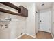 Clean mud room with tile floors, wire shelving, and convenient storage at 16351 E 104Th Pl, Commerce City, CO 80022