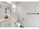 Clean bathroom with white vanity and black accents at 1750 Marlowe W Cir, Erie, CO 80516