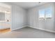 Bright bedroom with attached bathroom and carpet at 1750 Marlowe W Cir, Erie, CO 80516