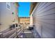 View of the backyard in between homes, landscape, and patio furniture at 8829 Animas River St, Littleton, CO 80125