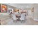 Cozy dining area with a round table and seating for six, adjacent to the modern kitchen at 8829 Animas River St, Littleton, CO 80125