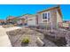 Well-manicured front yard with tasteful xeriscaping enhancing this home's curb appeal at 8829 Animas River St, Littleton, CO 80125