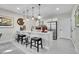 Modern kitchen featuring a breakfast bar with seating, sleek appliances, and stylish lighting at 8829 Animas River St, Littleton, CO 80125