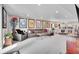 Expansive living room featuring an oversized sofa, plush seating and large art pieces adorning the wall at 8829 Animas River St, Littleton, CO 80125