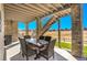 Covered patio featuring an outdoor dining table and chairs for entertaining at 8829 Animas River St, Littleton, CO 80125