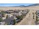 A lovely aerial view showing homes backing to open space and native grasses surrounded by natural beauty at 9896 W Freiburg Dr # 1B, Littleton, CO 80127