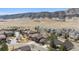 A beautiful aerial view of homes surrounded by native vegetation near the foothills in a quiet neighborhood at 9896 W Freiburg Dr # 1B, Littleton, CO 80127