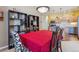 Inviting dining room features dark shelving and view into the kitchen featuring stainless steel appliances at 9896 W Freiburg Dr # 1B, Littleton, CO 80127